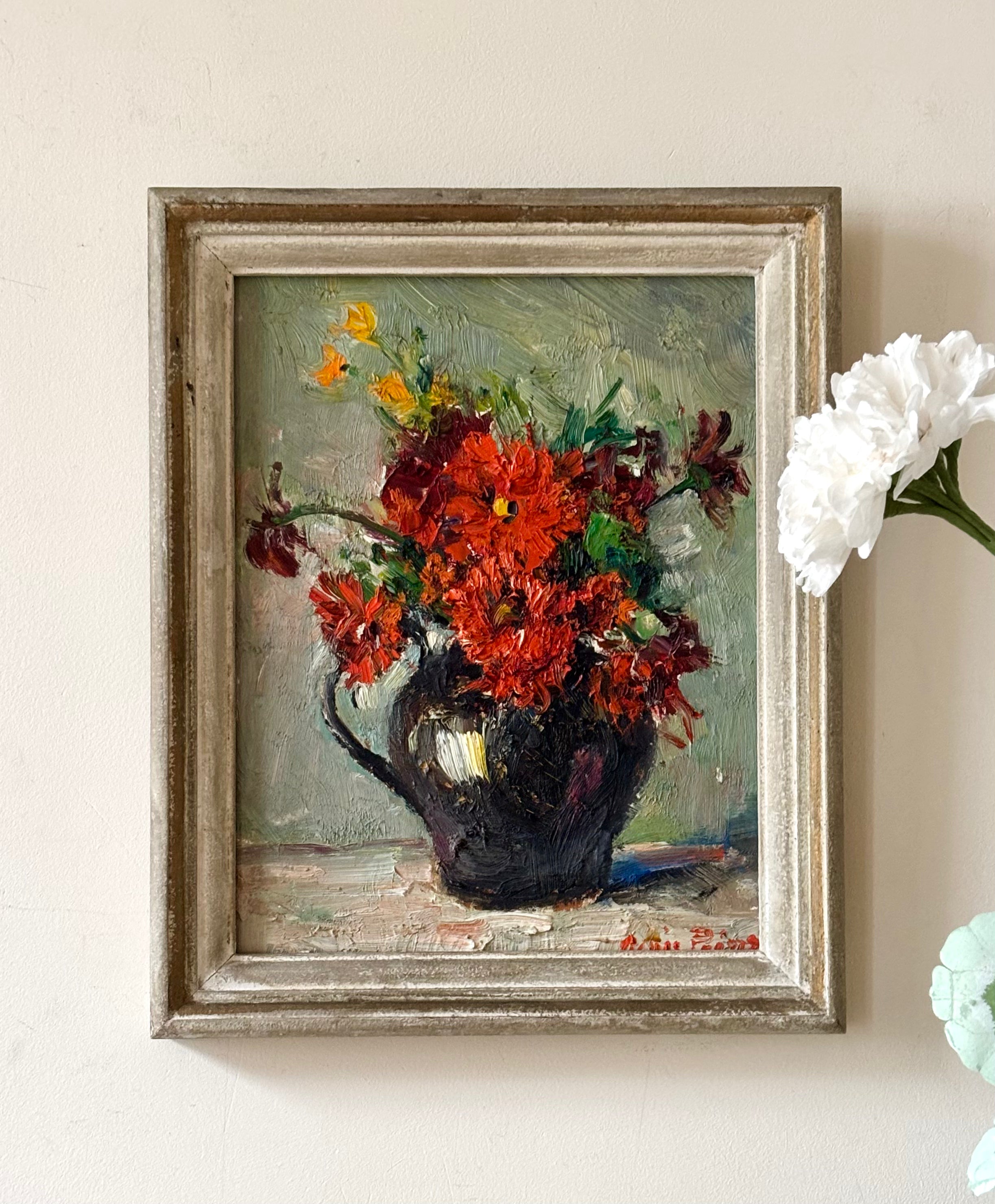 Red Flowers in Black Jug