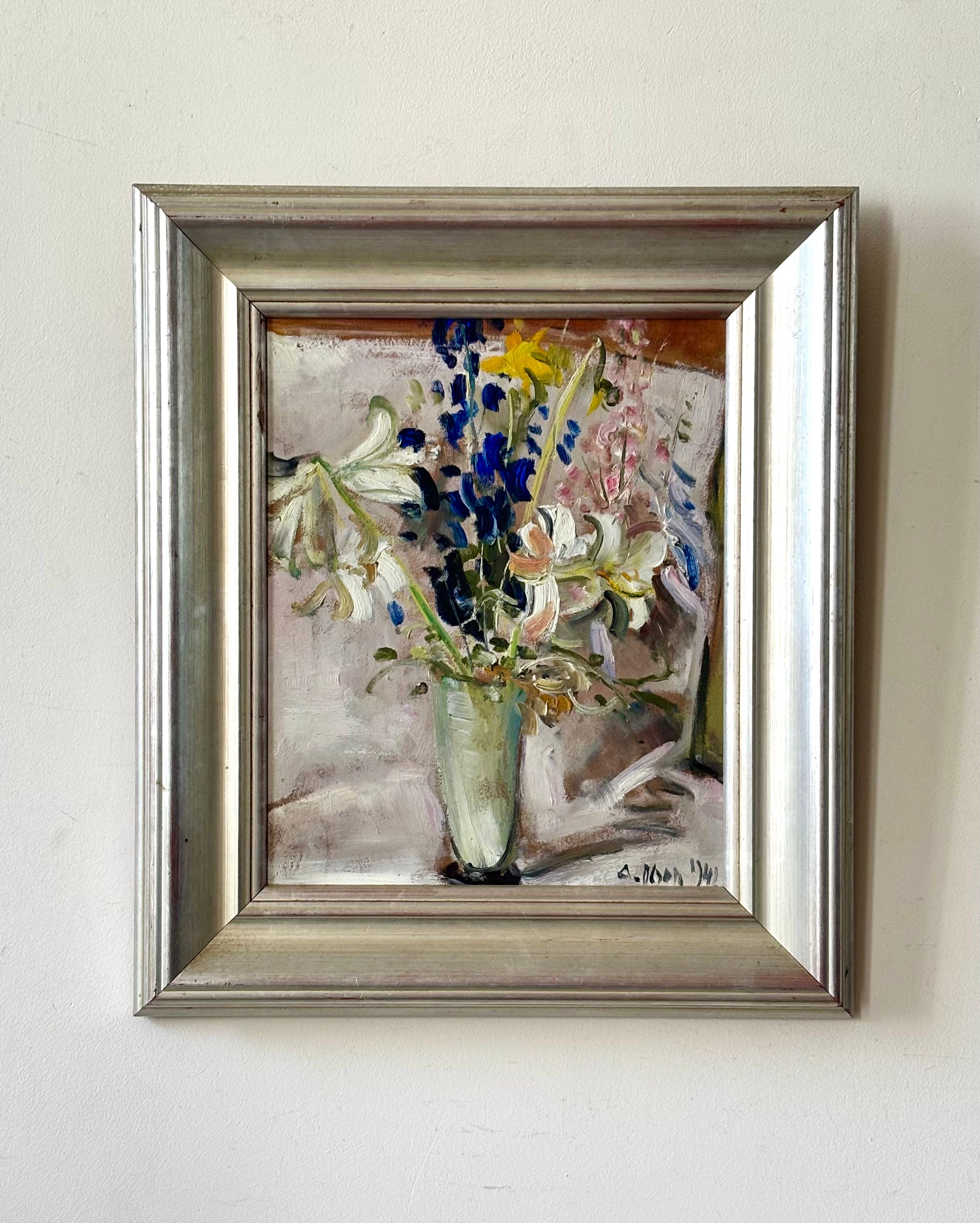 Spring Flowers in a Tall Glass Vase