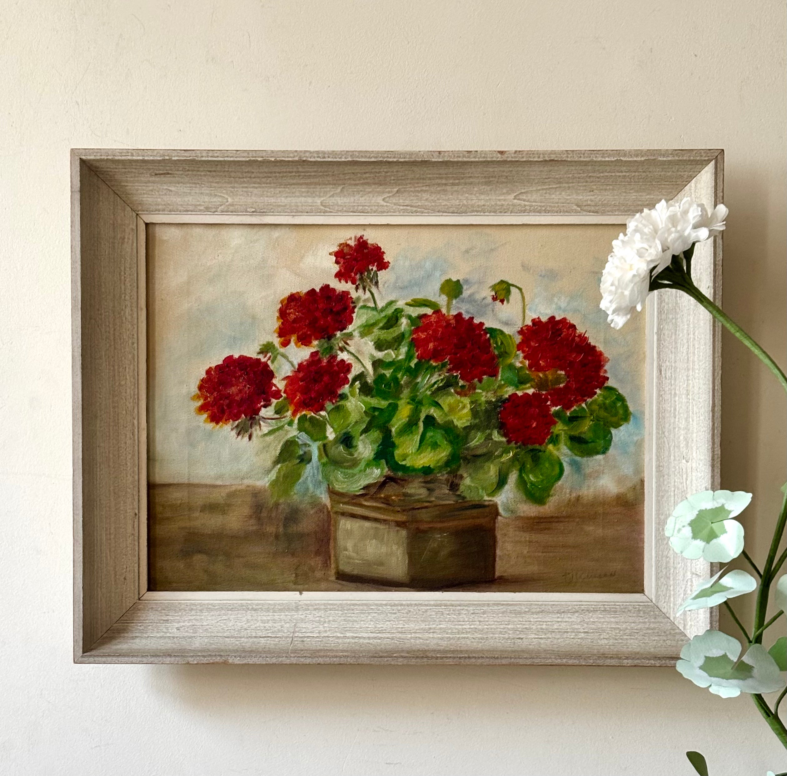 Red Geraniums in a Brown Vase