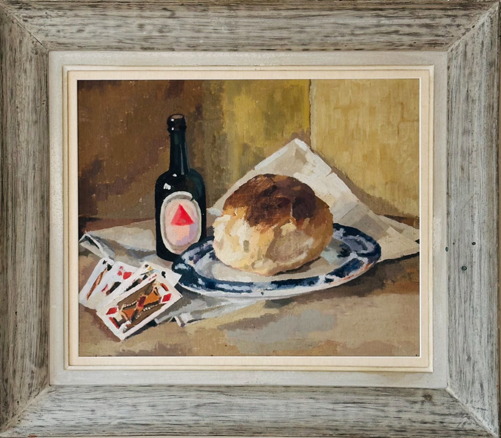 Vintage decorative still life painting depicting a beer bottle, a plate of bread, and playing cards on a newspaper on top of a table.