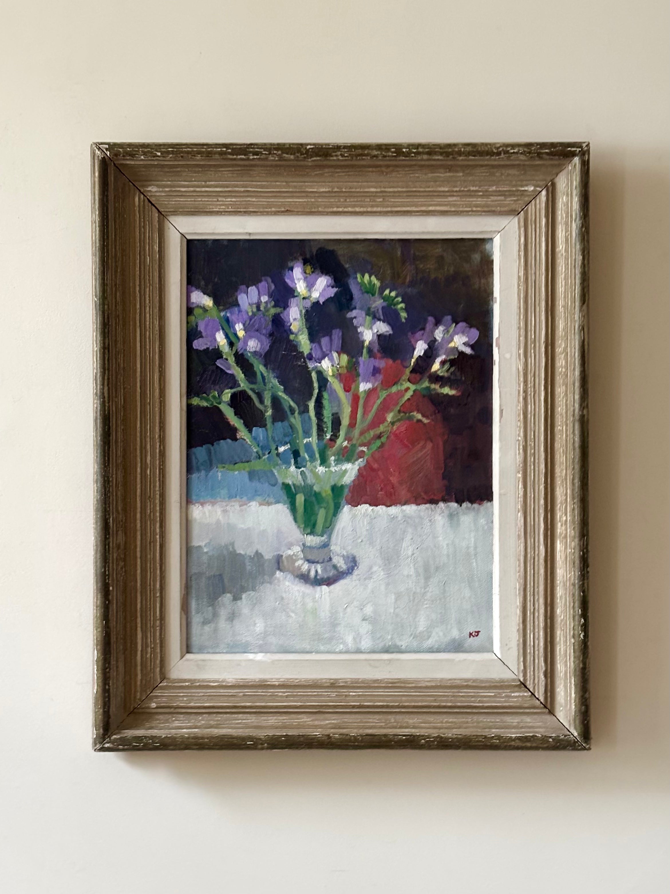 Purple Flowers in Glass Vase