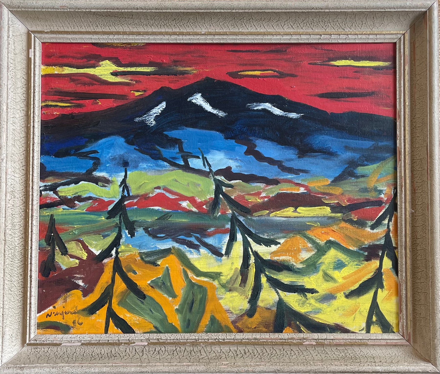 Dramatic vintage decorative painting of a blue mountain surrounded by a yellow landscape and black trees.